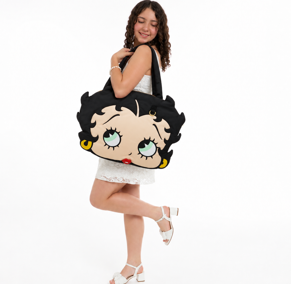 Sienna holding the oversized Betty Boop padded nylon tote bag for size reference