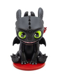 CultureFly FlyGuys Toothless sitting with green eyes and a smile on a red base