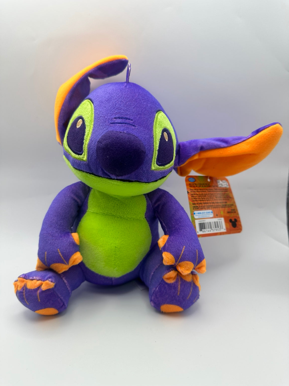 Just Play Disney Stitch Halloween plush in purple, green and orange with spider designs