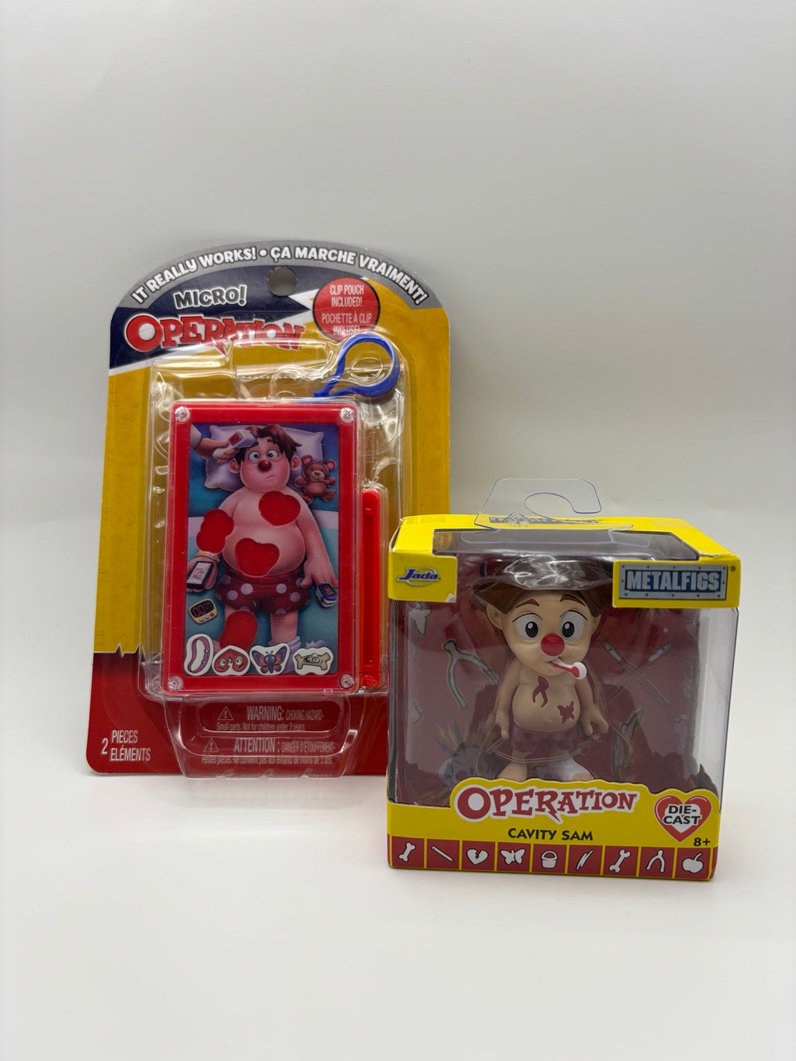 Operation gift set with Micro Operation magnetic game and Jada Metalfigs Cavity Sam die-cast figure, front packaging