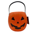Orange jack-o-lantern trick-or-treat bucket with black handle