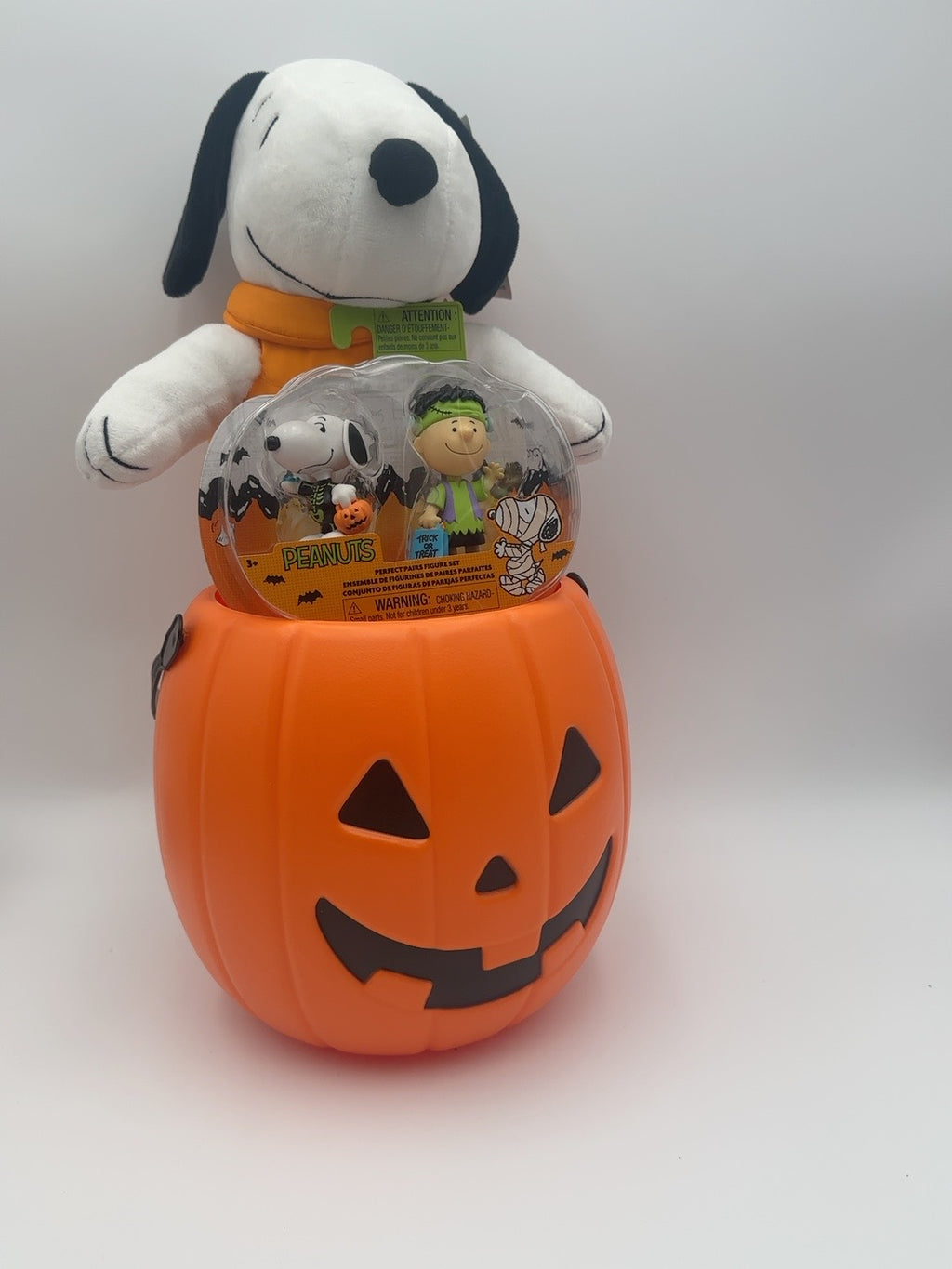 Snoopy Halloween plush and Peanuts Perfect Pairs figure duo in an orange pumpkin gift pail