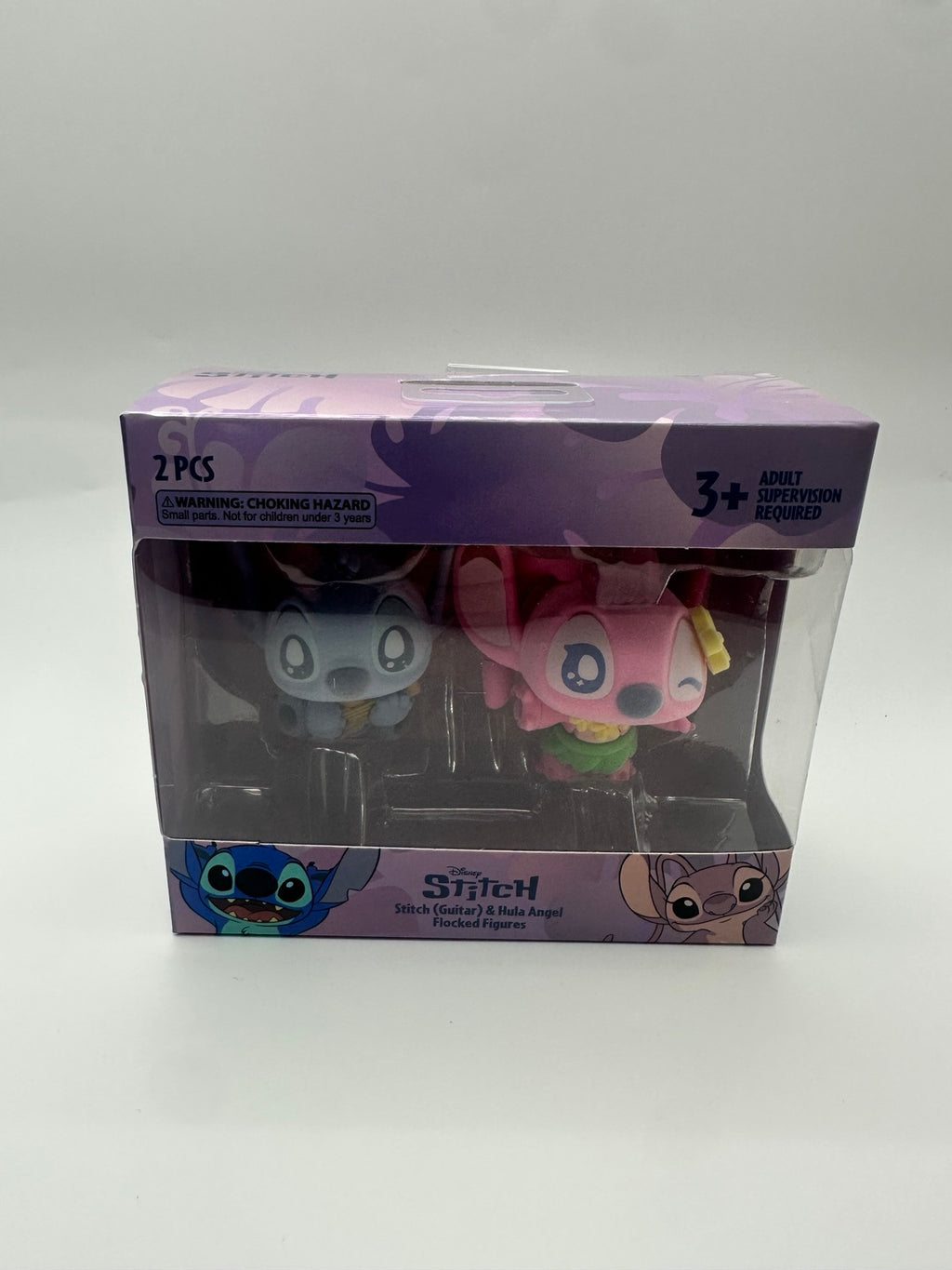 Included Stitch Guitar and Hula Angel flocked figure two-pack