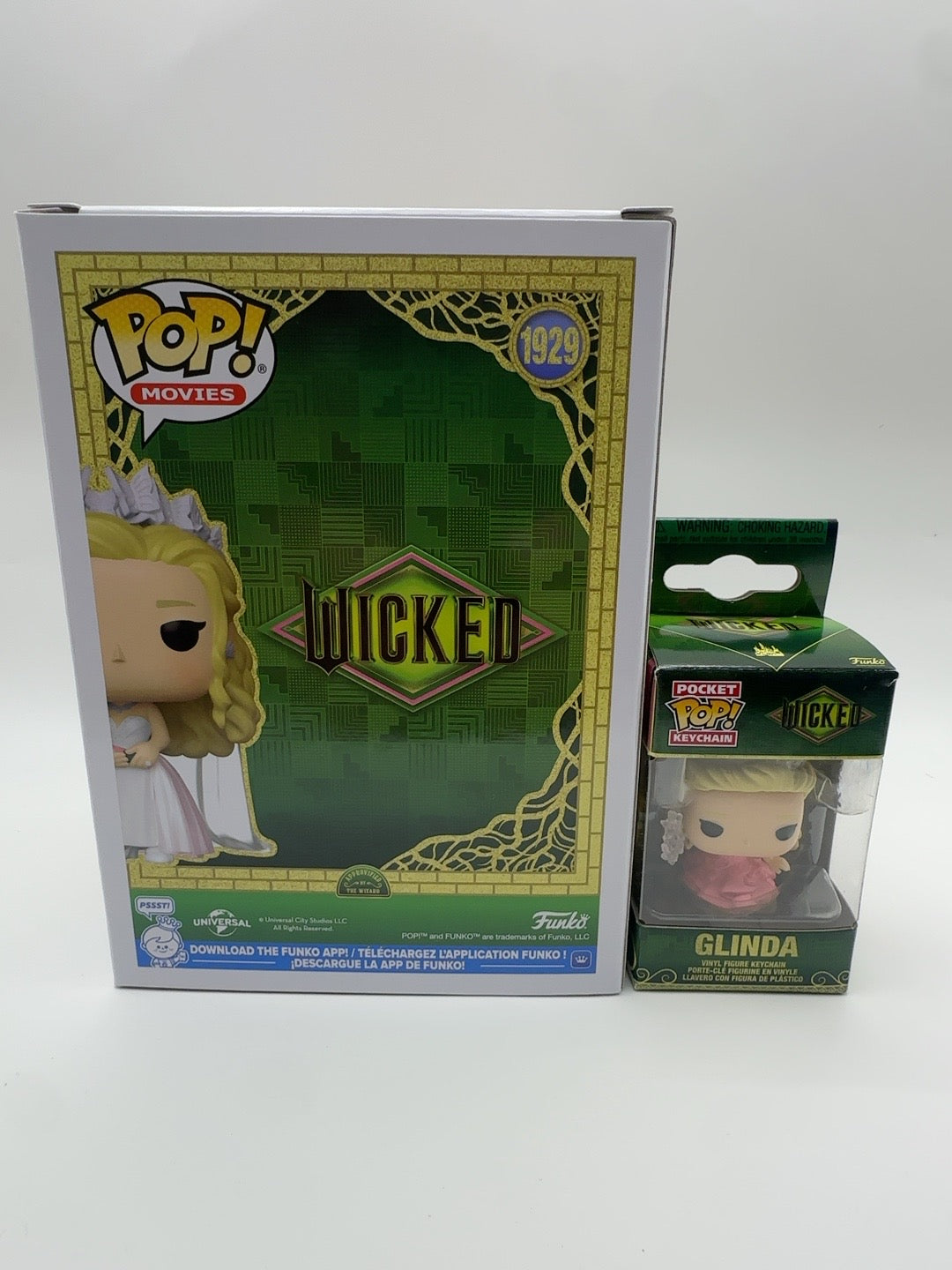 Back of Glinda in Wedding Gown Pop number 1929 box alongside the boxed Glinda keychain
